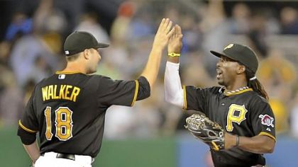 Pirates second baseman Neil Walker celebrates with center fielder Andrew McCutchen. Both have been key to the team's success this season.