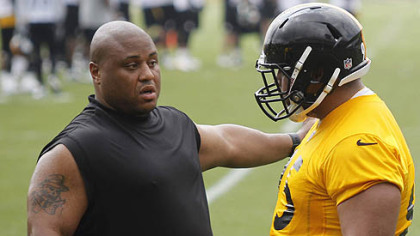 Veteran Casey Hampton, left, talks with rookie Alameda Ta'amu during the Steelers' minicamp in June.