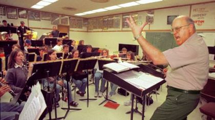 North Allegheny Band Director Frank Farina motions toward the cairnets during rehersal for the up coming Gargaro Production of "Music Man " at the Byham.