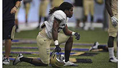 Lafayette Pitts rests on the sidelines of practice.
