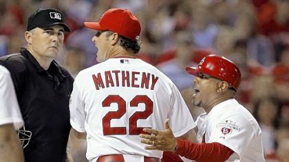 Cardinals manager Mike Matheny, right, argues with home-plate umpire Lance Barrett after Barrett threw Cardinals third-base coach Jose Oquendo out of the game in the sixth inning.