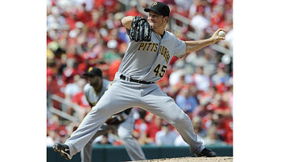 Starting pitcher Erik Bedard throws against the St. Louis Cardinals in the first inning.