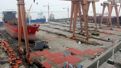 Unfinished tankers sit idle at Dongfang Shipbuilding in Yueqing County, China. Small and medium Chinese shipbuilders have been devastated by overcapacity and sinking freight rates.