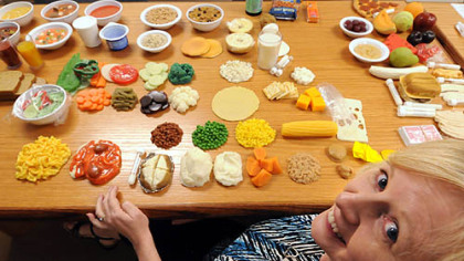 Diabetic nurse educator Linda Reichart presides over a banquet of plastic food showing exactly the proper serving size for patients needing information on diabetes at the Community Health Clinic of Butler.