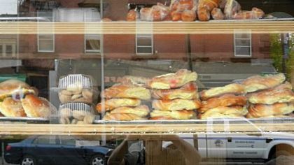 Pastries and other delights fill a bakery window.