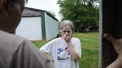 Barb Romito breaks down after water delivery coordinator Janet McIntyre tells her that an anonymous sponsor will pay for her water buffalo (or tank) for another month.  
Mrs. Romito and her husband, Dave, are one of three households using water buffalos in the Woodlands.