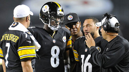 Steelers offensive coordinator Todd Haley talks with his quarterbacks during a timeout against the Colts.