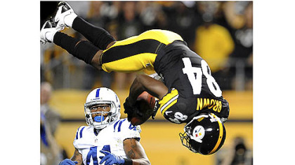 Steelers receiver Antonio Brown flies past Colts safety Antoine Bethea for a touchdown in the first quarter Sunday at Heinz Field.