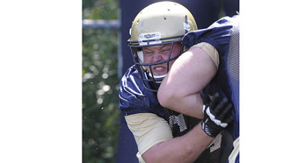 Offensive lineman Chris Jacobson works on blocking drills during a recent Pitt practice.