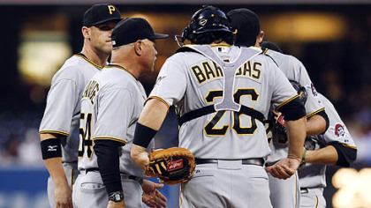 Pittsburgh Pirates pitching coach Ray Searage, second from left, meets with pitcher Kevin Correia on the mound during the first inning against the Padres on Monday in San Diego. Pirates catcher Rod Barajas stands at right.