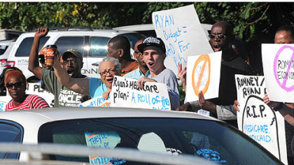 A crowd of protesters greeted Paul Ryan in Carnegie this morning.