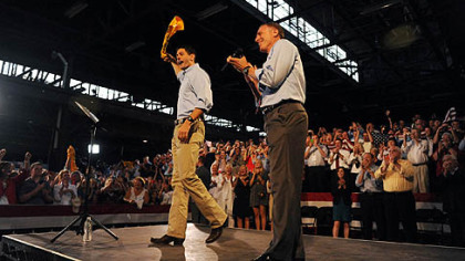 Paul Ryan waves a Terrible Towel on stage with Tim Murphy in Rosslyn Farms.