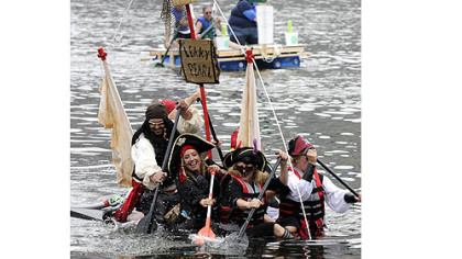 Festivals: Despite taking on water, the Leaky Pearl Pirate float, sailed by a group of friends from Mt. Lebanon, took second place in the Anything That Floats Race on the Allegheny River during last year's Three Rivers Regatta.