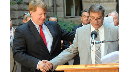 Allegheny County Executive Rich Fitzgerald, left, introduces transit union Local 85 president Steve Palonis at a news conference Tuesday announcing a funding solution to avoid Port Authority service cuts.