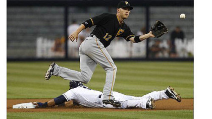 Pirates shortstop Clint Barmes pulls a late throw as the Padres' Everth Cabrera steals second.