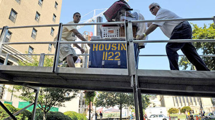 Housing carts are used to move belongings up a ramp near William Pitt Union at the University of Pittsburgh on Tuesday, the first of move-in days for the fall semester.