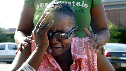 Charmaine King of New Kensington, the grandmother of  three-day-old Bryce Coleman who was taken from Magee-Womens Hospital, is consoled by her niece, Quevonna Oaks, outside the hospital.