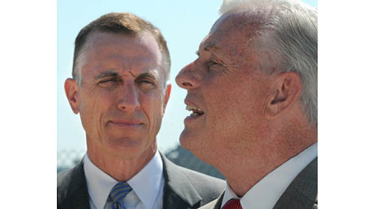 Rep. Tim Murphy, R-Upper St. Clair, left, and state Auditor General Jack Wagner speak Wednesday after a tour of the 911th Airlift Wing Air Force Reserve Base at Pittsburgh International Airport. The two continue to seek information from the Air Force on why the base has been selected for closure.