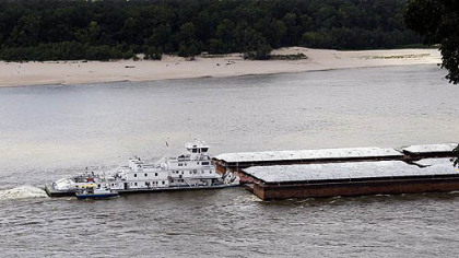 This tow boat and barge setup works its way up river on the Mississippi side of the Mississippi River  at Vicksburg, Miss.  The exposed sand, sand bars and riverbeds along the river have caused traffic to slow to a crawl.