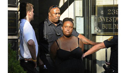 Police take Breona Moore, 19, of East McKeesport into custody on Thursday at the Investment Building on Fourth Avenue.