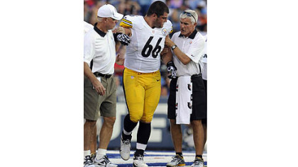 David DeCastro is helped off the field after injuring his right knee against Buffalo in the first quarter Saturday at Ralph Wilson Stadium.