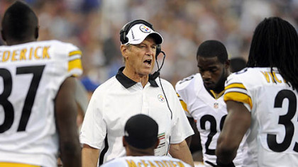 The Steelers' defensive coordinator talks to his squad during a timeout against Buffalo in the first quarter.