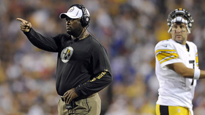 Steelers head coach Mike Tomlin signals to his team against Buffalo in the second quarter.