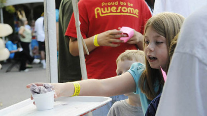 Catherine Spiller, 9, grabs a bowl of "Blue's Clue's" ice cream.