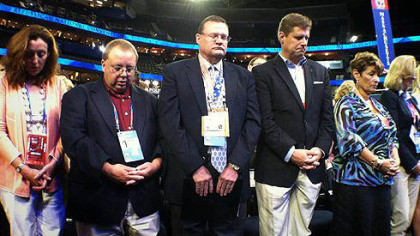 The Republican National Convention in Tampa opened with prayer. These are members of the Massachusetts delegation.