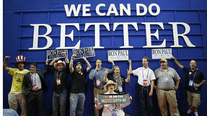 Ron Paul supporters pose for a picture after an abbreviated session of the Republican National Convention.