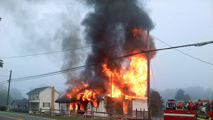 A PennDOT employee awakened an Armstrong County family shortly before their home was engulfed in flames.