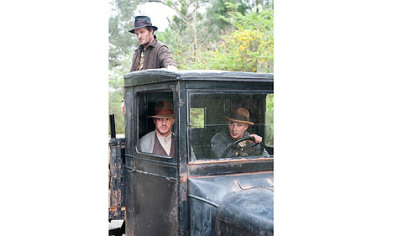Jason Clarke, Tom Hardy and Shia LaBeouf portray moonshining brothers in "Lawless."