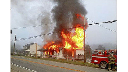 A PennDOT employee awakened an Armstrong County family minutes before their home was engulfed in flames.