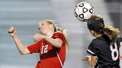 Peters Township's Veronica Latsko, left, battles for loose ball against Upper St. Clair's Megan Hindman fight for the ball in November. Latsko, the Post-Gazette's girls player of the year, led Peters Township with 45 goals in 2011.