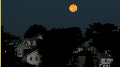 Carrying its catchy nickname that brought so much attention, the blue moon is caught this morning over Dormont not long before it set.