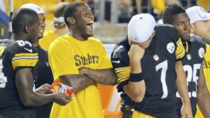 Quarterback Ben Roethlisberger channels a little bit of Tim Tebow on the sideline, much to the delight of Mike Wallace, as the Steelers take on Carolina Thursday night at Heinz Field.