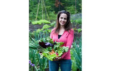 Niki Jabbour uses PVC tubing to create a hoop house for her plants so that she is able to harvest from the garden during the winter.