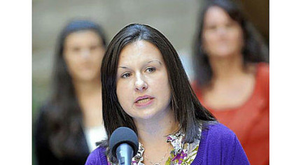 Heather Uphold of Brighton in Beaver County speaks to the media about the challenges faced by military spouses in the workplace Tuesday during a news conference.
