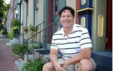 Frank Quinn sits on his stoop on Monterey Street.