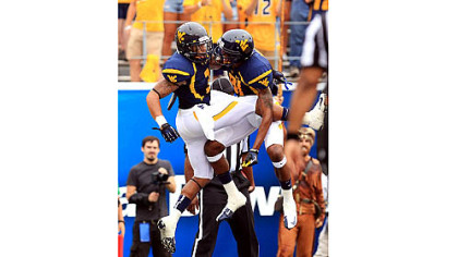 Stedman Bailey, left, celebrates an early touchdown with D.J. Woods.