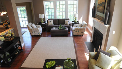 The great room, which connects to the kitchen, features large Andersen windows and a Heat & Glo gas fireplace with wood mantel.
