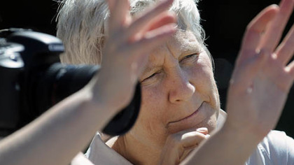 Jenny Fine gestures and waits for input from Ann Hamilton, right, working outside at the Bayer Corp.