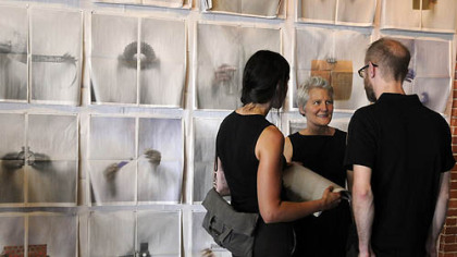 Factory Direct: Pittsburgh opening with Ann Hamilton talking to patrons at the Guardian Self-Storage building in the Strip District.