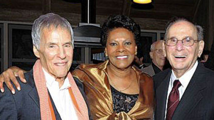 An Oct. 17, 2011, photo shows songwriters Bert Bacharach, left, and Hal David with singer Dionne Warwick at the "Love, Sweet Love" musical tribute to Mr. David on his 90th birthday in Los Angeles. Mr. David died Saturday in Los Angeles.