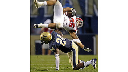 Pitt's Cullen Christian upends Youngstown State's Jamaine Cook in the second quarter Saturday night at Heinz Field.