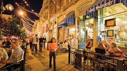 People enjoying an evening in Larimer Square's outdoor cafes and shops.
