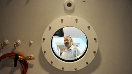 Peter Strobl inside a pressure chamber.
