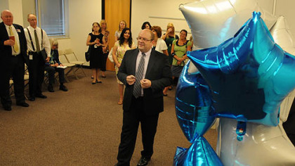 David Martin, principal of STREAM Academy, addresses the audience before a ribbon cutting. The online charter school has been revamped for this fall.