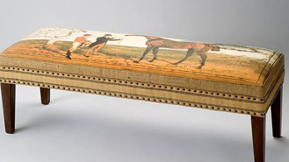 The Elizabeth Lucas Company specializes in art decorated furniture. This is its Thoroughbred Bench. The company also has pillows and totes that depict the riding life.