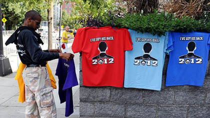 A vendor prepares shirts featuring President Barack Obama on Monday outside the Charlotte Convention Center ahead of the Democratic National Convention in Charlotte, N.C.